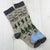 these are my hiking socks with pine trees, hiker and a lake