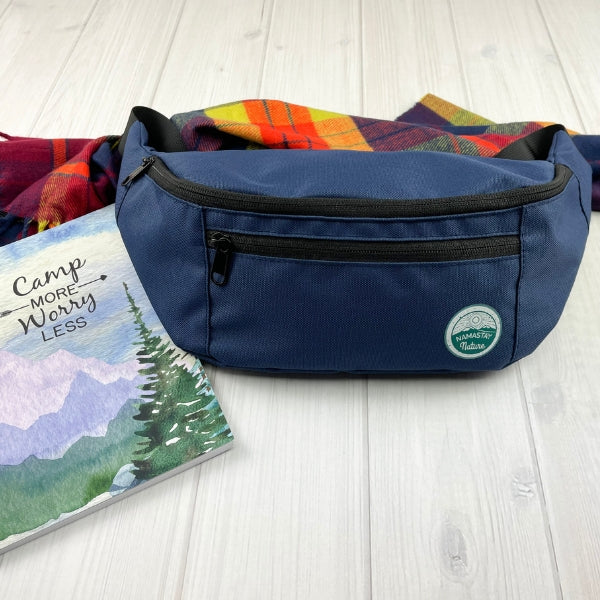 navy blue fanny pack with camp more worry less camping journal