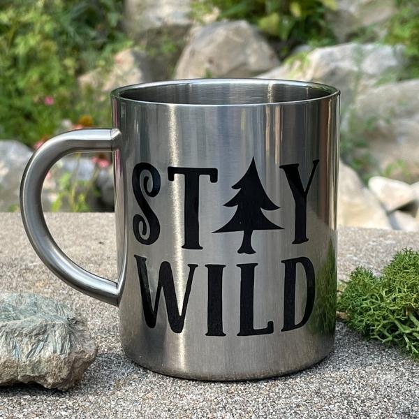 stay wild stainless steel mug with a pine tree design